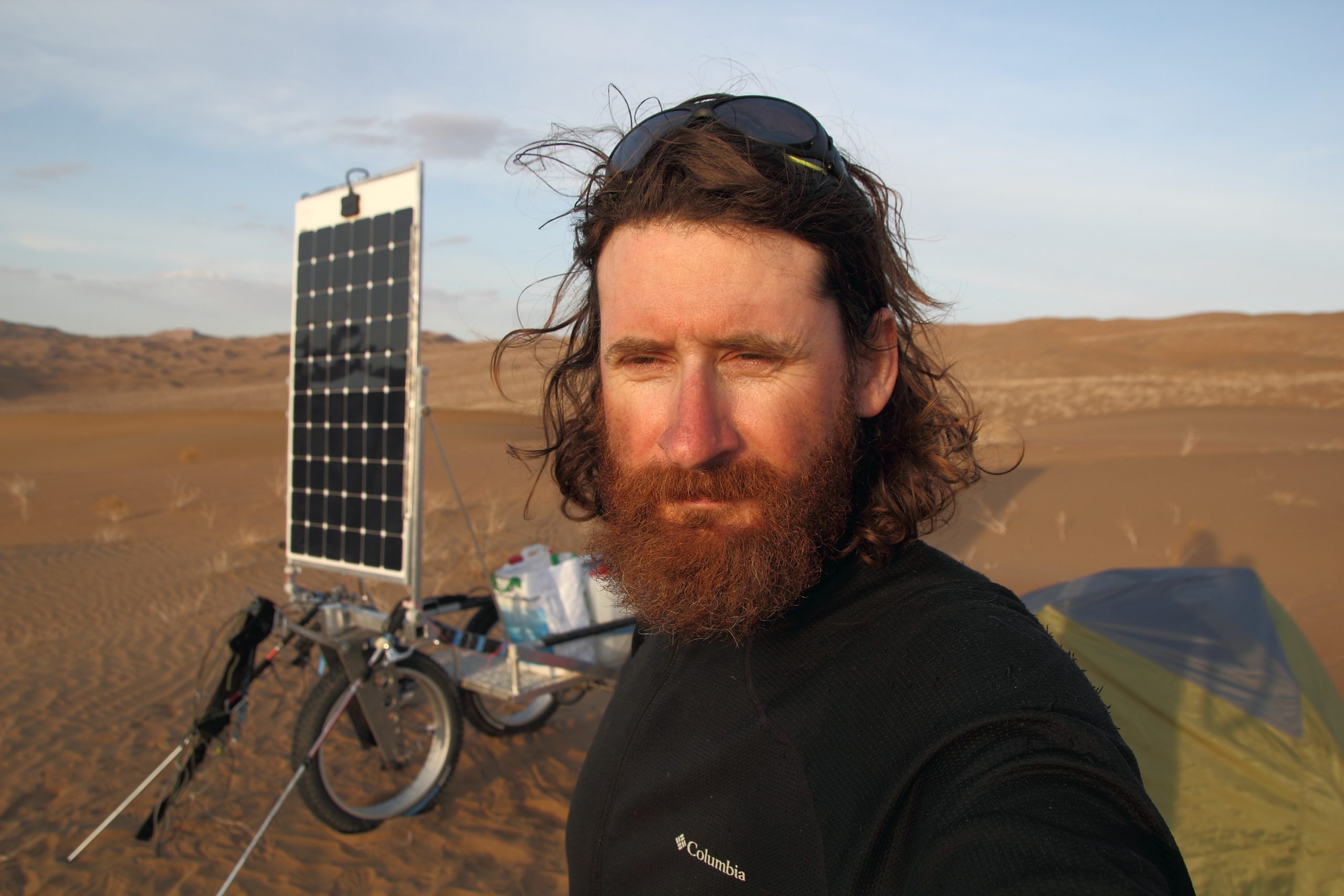 Olivier Coste selfie with his solar-powered cart with genasun controllers 